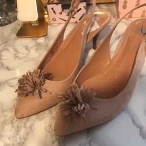Nude pom pom heels